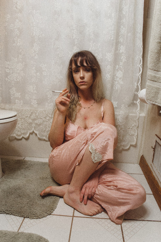 Woman smoking in the bathroom