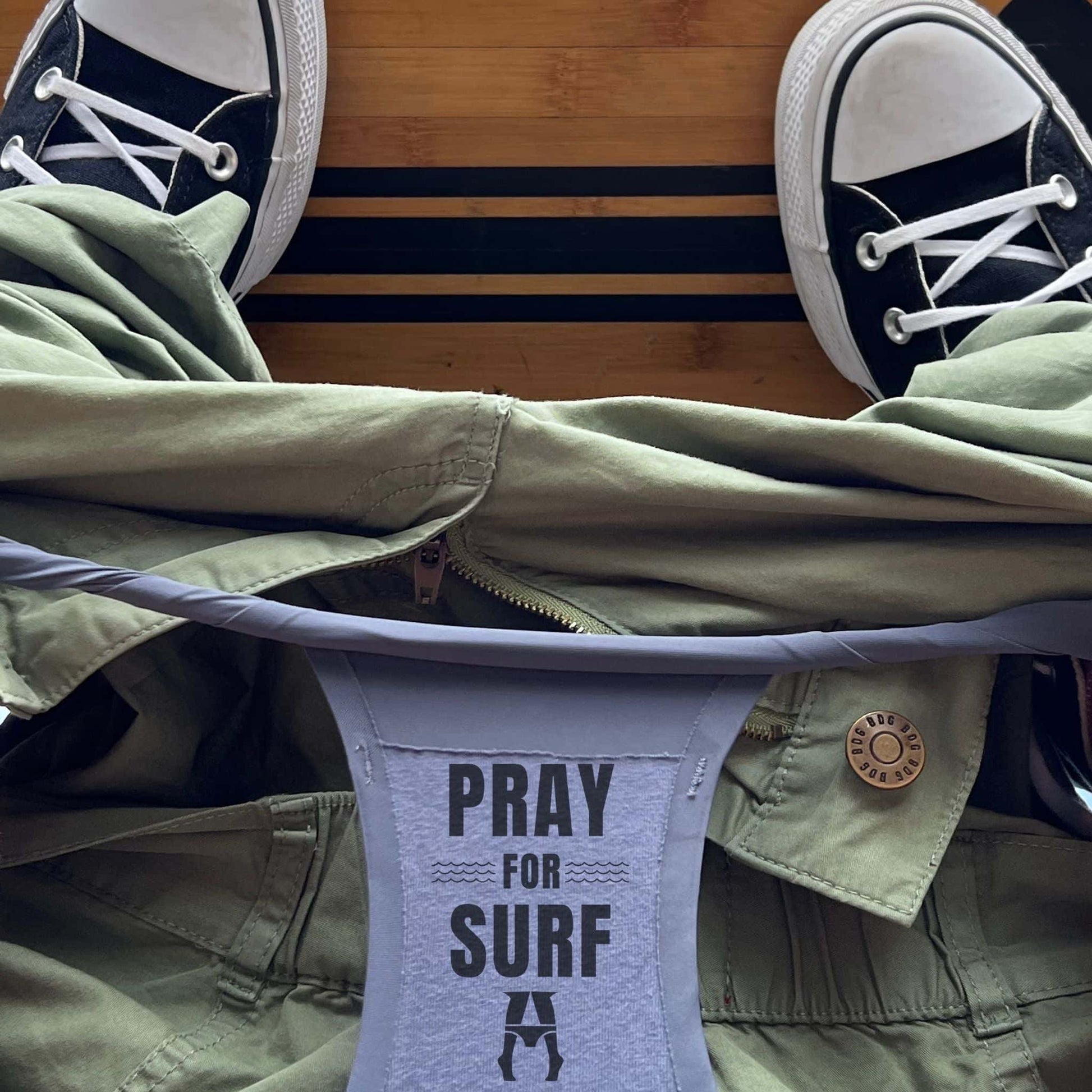 Person wearing sneakers and pray for surf daily briefs super comfy underwear.