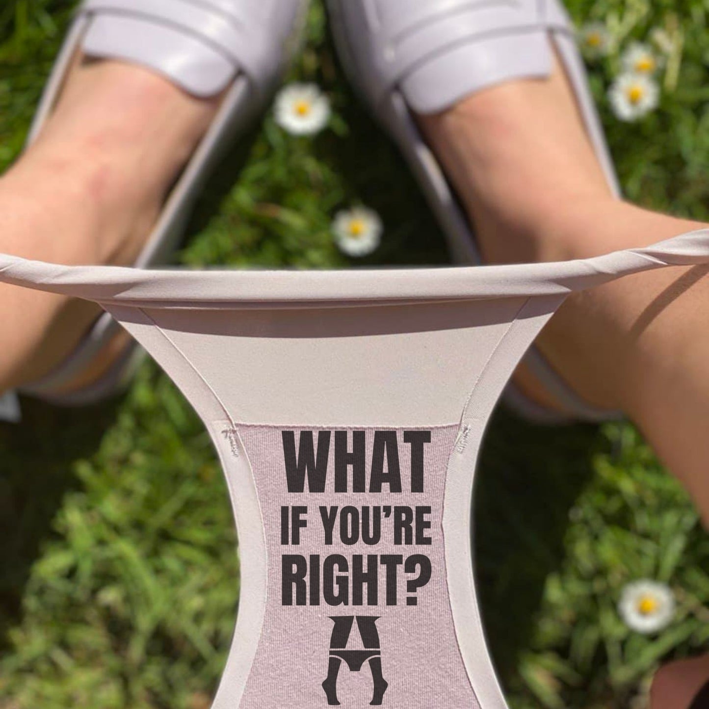 selflove woman wearing underwear with 'What if you're right?' text on them grass.